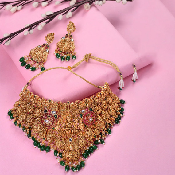 https://designerszone.in/vi/products/gold-plated-kemp-stone-studded-lakshmi-design-with-dangling-green-beads-choker-set