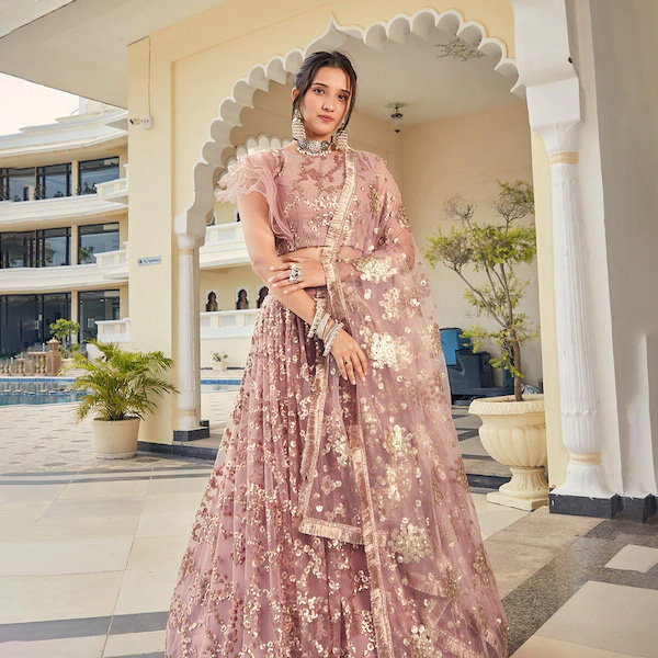 Peach Layered SemiStitched Lehenga with Brocade Blouse and Ruffled Net Dupatta main image 1